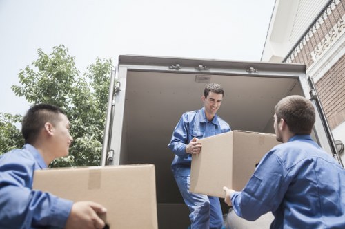 Professional moving team arranging belongings in Marylebone